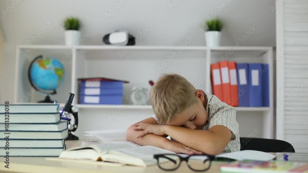 schoolboy was tired and fell asleep at Desk at school schoolboy was tired and fell asleep at Desk at school
