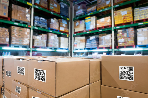 Smart logistic industry 4.0 , QR Codes Asset warehouse and inventory management supply chain technology concept. Group of boxes in storehouse can check product inside and order pick time. photo