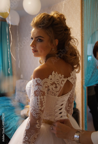 Beautiful young bride is preparing for the wedding