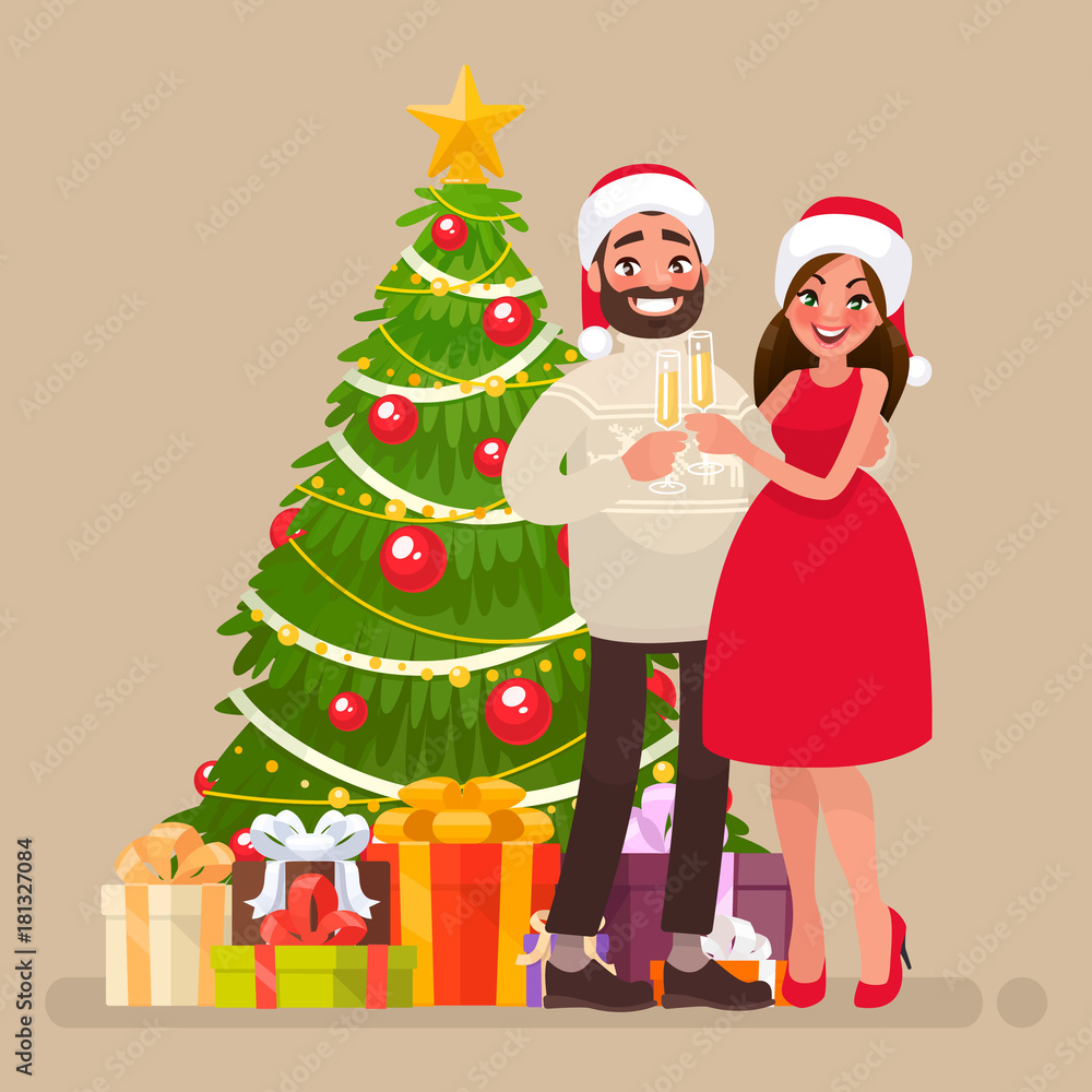 Merry christmas and a happy new year. Young family at christmas tree Merry christmas and a happy new year. Young family at christmas tree