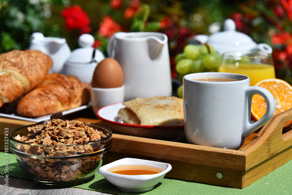 Breakfast served with coffee, juice, croissants and fruits Breakfast served with coffee, juice, croissants and fruits