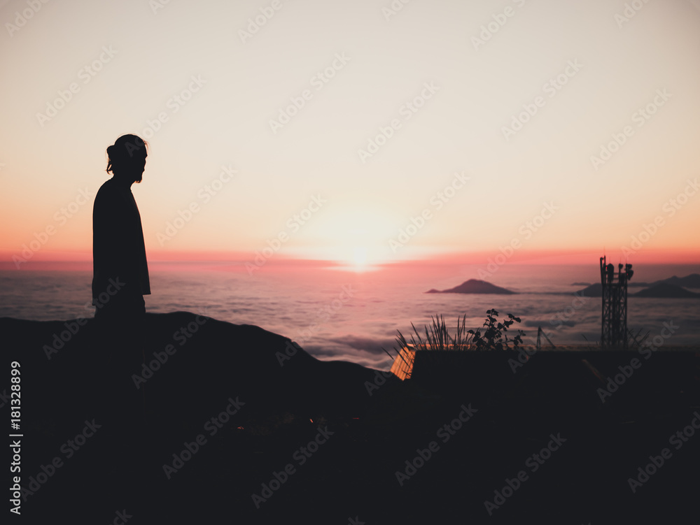 man standing sunset clouds mountains sky skyline evening