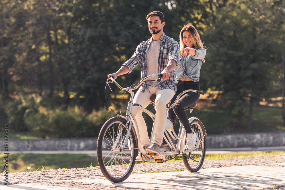 Couple with a tandem bicycle Couple with a tandem bicycle