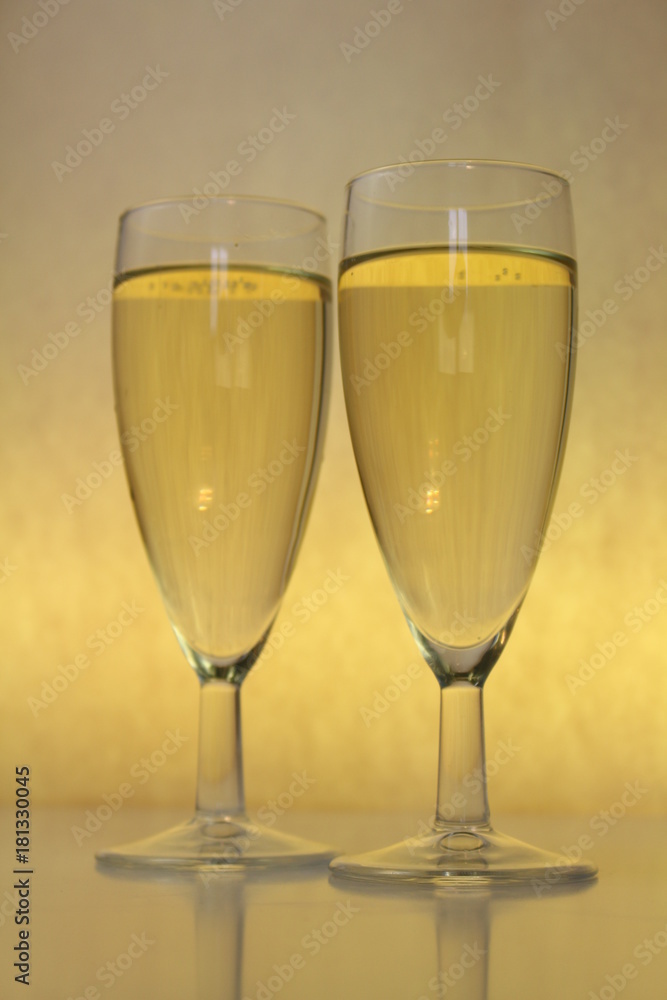 two full glasses on a yellow background