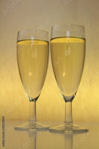two full glasses on a yellow background