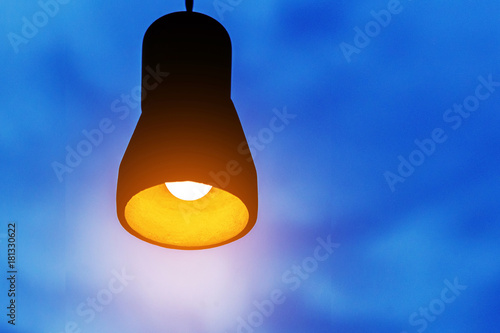 bulb on a dark blue background, the concept of creativity.