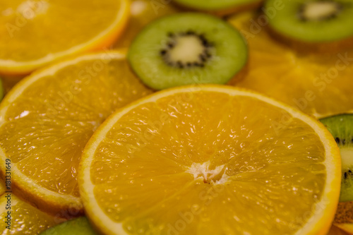 Background of the kiwi and orange fruits. Selective focus