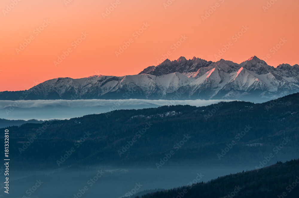 panorama over misty Gorce to snowy Tatra mountains in the morning, Poland landscape