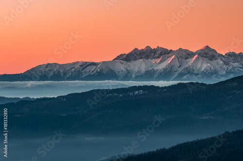 panorama over misty Gorce to snowy Tatra mountains in the morning, Poland landscape