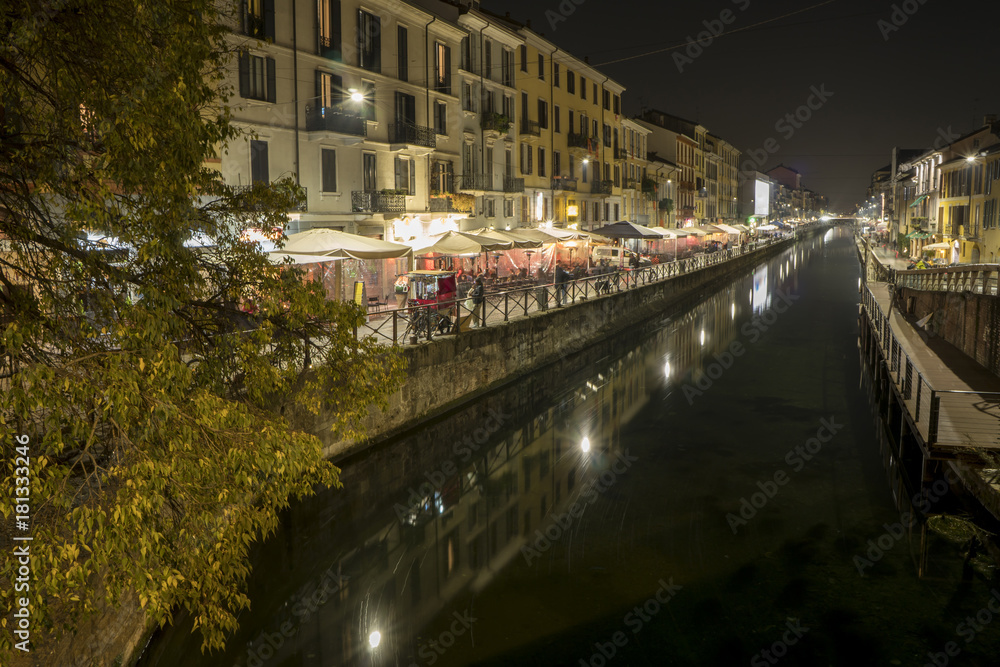 Milan, Italy: the Naviglio Grande canal waterway at evening. This district is famous for its restaurants, cafes, pubs and nightlife.