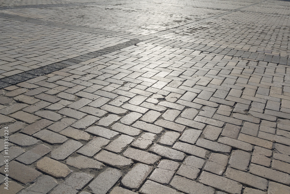 Paving stones are illuminated by light. Backgrounds and textures