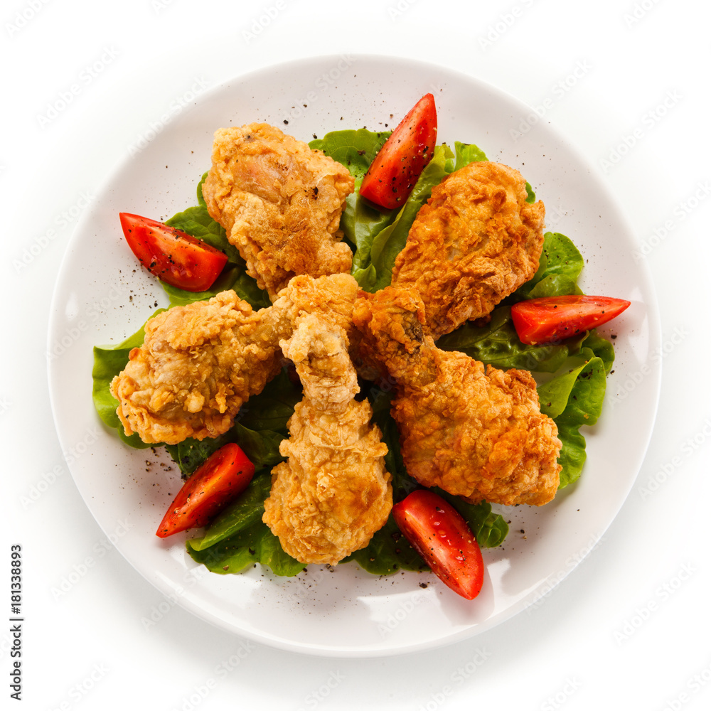 Fried chicken drumsticks on white background Fried chicken drumsticks on white background