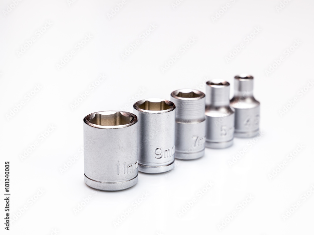 set of interchangeable heads for chrome socket wrench. Isolated on white background. set of interchangeable heads for chrome socket wrench. Isolated on white background.