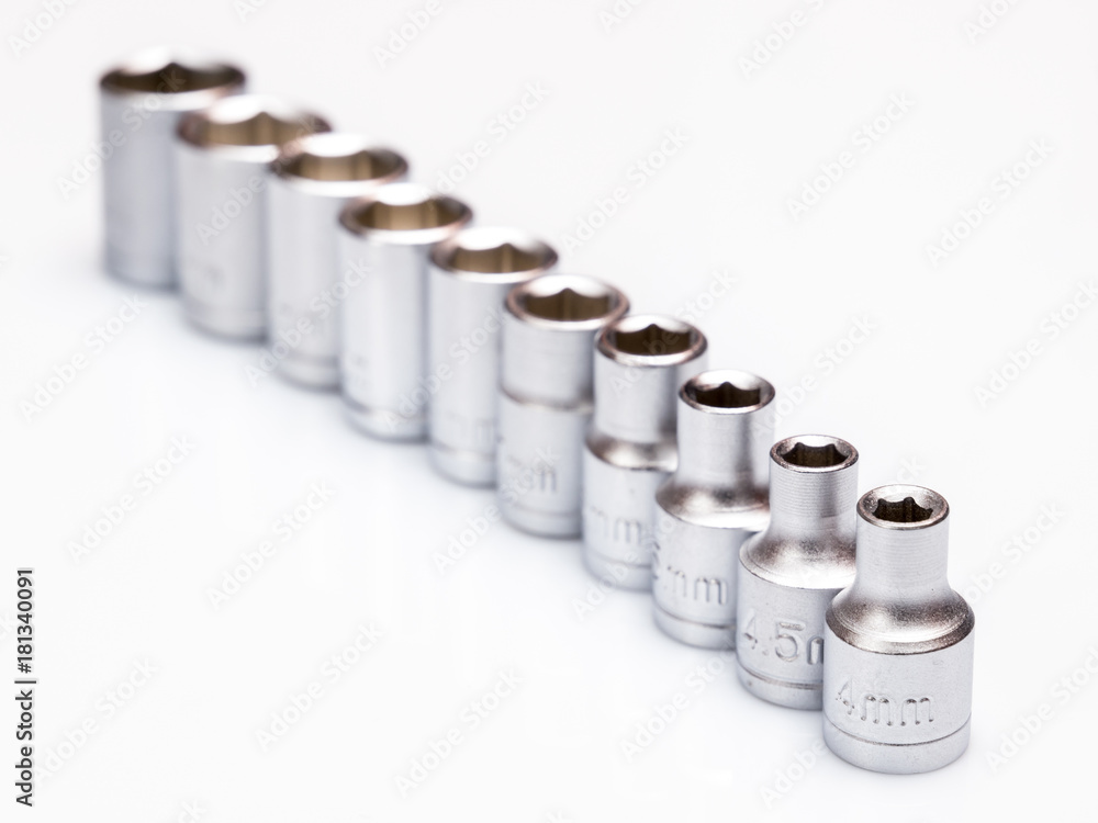 set of interchangeable heads for chrome socket wrench. Isolated on white background. set of interchangeable heads for chrome socket wrench. Isolated on white background.