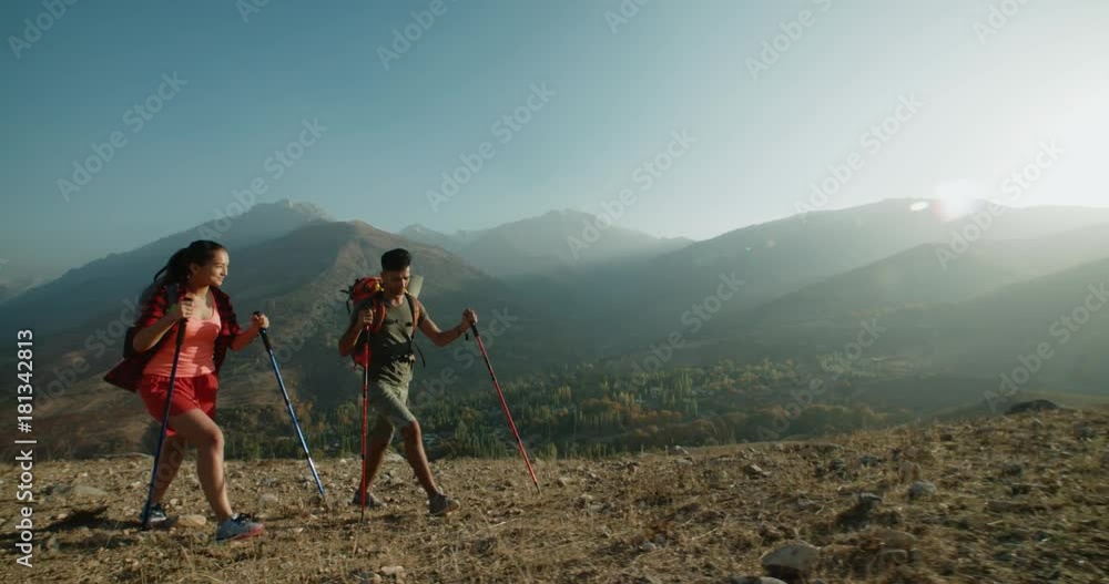 young active Asian couple travelling in the mountains during their honeymoon, Steadicam shot young active Asian couple travelling in the mountains during their honeymoon, Steadicam shot