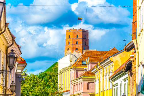 Colorful facades of the old town of Vilnius with the gediminas castle, Lithuania. photo