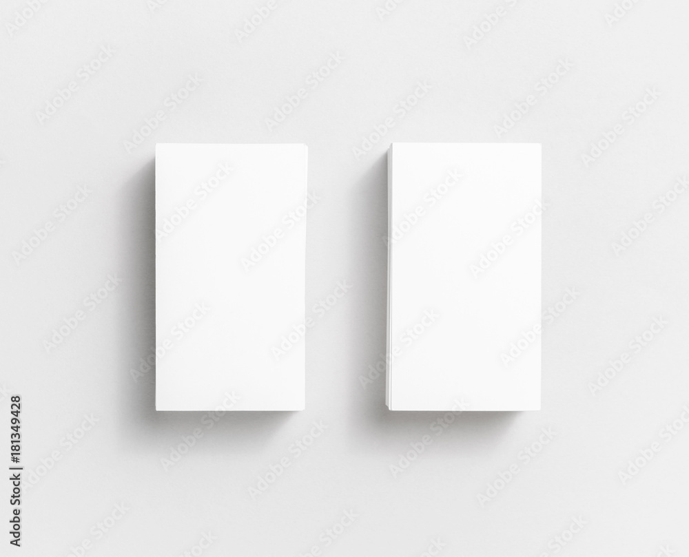 Photo of blank white paper business cards on paper background. Template for ID. Top view. Photo of blank white paper business cards on paper background. Template for ID. Top view.