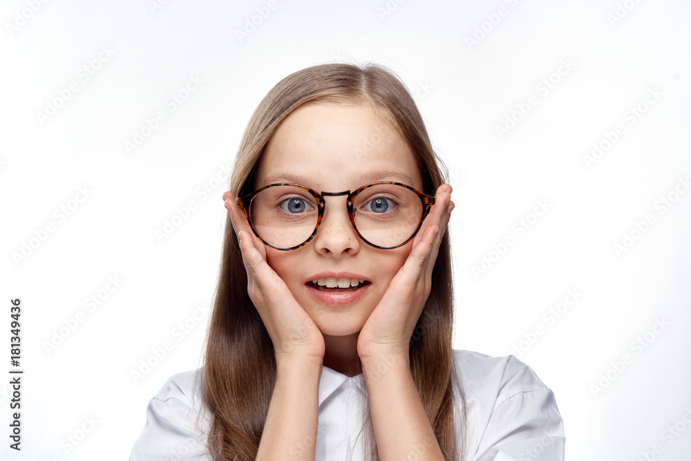 cute girl with glasses holds on to her face