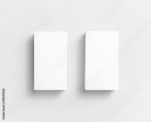 Photo of blank white paper business cards on paper background. Template for ID. Top view.
