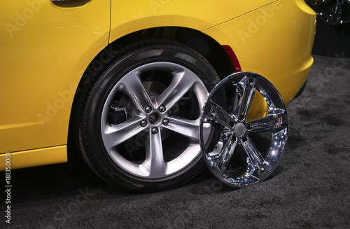 Car wheel with alloy rim and chrome rims cover © hafakot