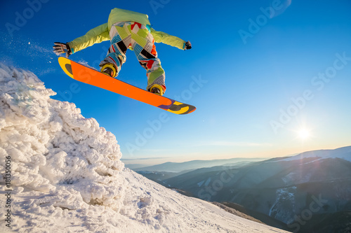 Carpatian mountains, winter, snowboard. Blue sky on the background.