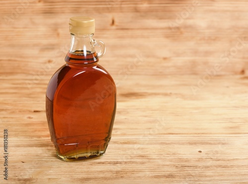 maple syrup on wooden background
