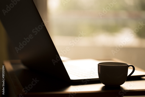 Laptop with hot coffee