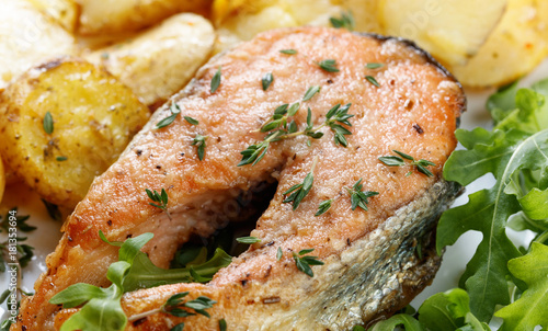 Roasted salmon with potatoes.