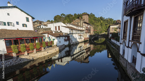 River as it passes through a small town. © hirgon