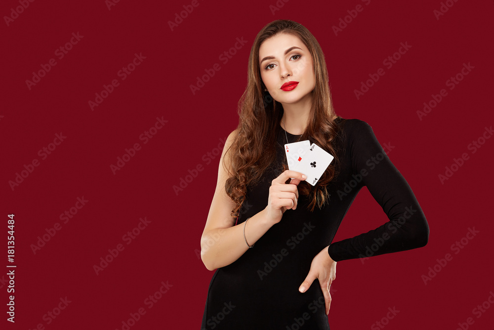 Beautiful caucasian woman in black dress with poker cards gambling in casino Beautiful caucasian woman in black dress with poker cards gambling in casino