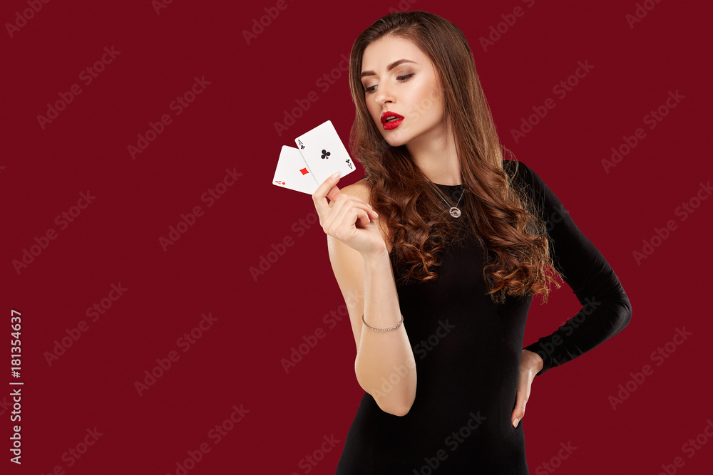 Beautiful caucasian woman in black dress with poker cards gambling in casino Beautiful caucasian woman in black dress with poker cards gambling in casino