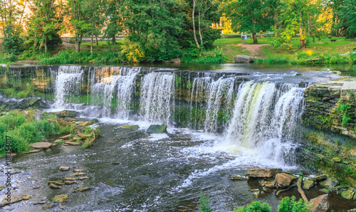 Jagala is the biggest waterfall in Estonia. Long exposure day shot. Close up. Water is red due to swamp organics.