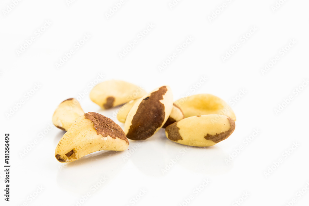A Bunch Of Healthy Brazilian Nuts On White Background With Reflection A Bunch Of Healthy Brazilian Nuts On White Background With Reflection