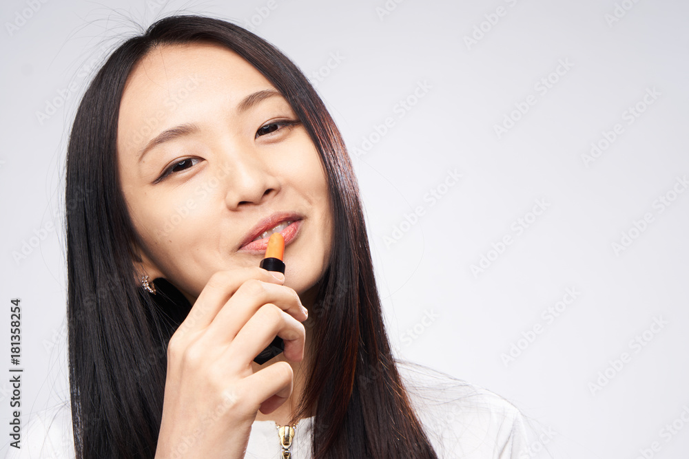 Asian, cosmetics, woman on white isolated background Asian, cosmetics, woman on white isolated background