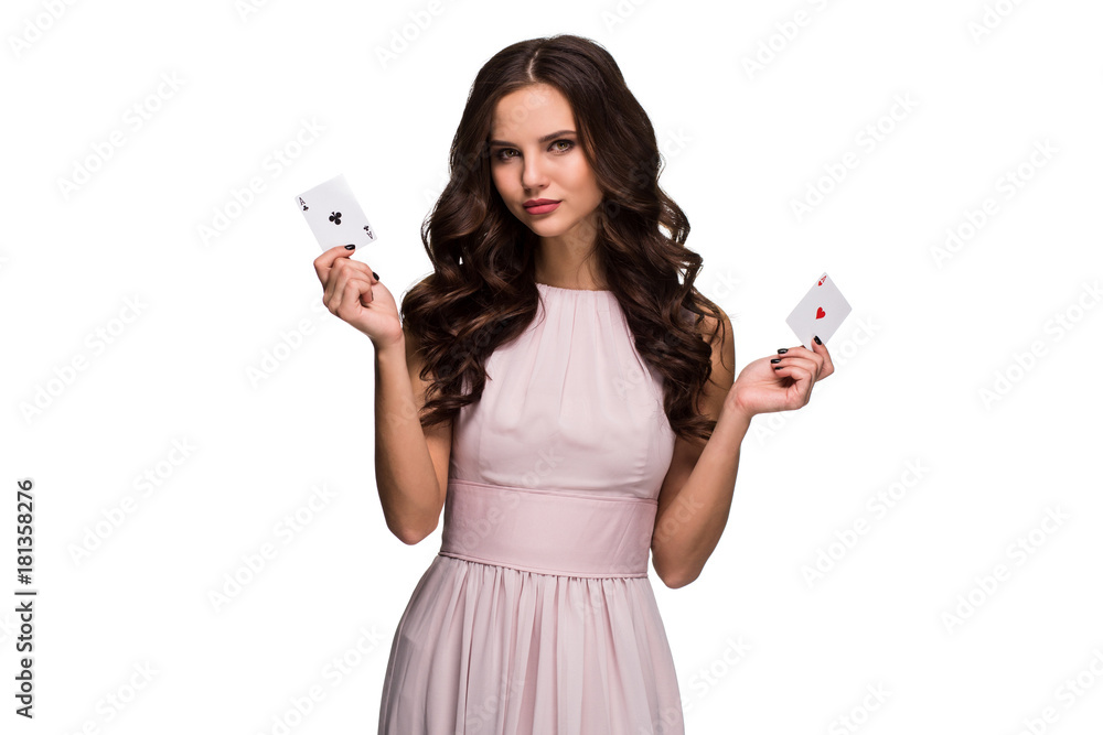 Beautiful confident woman showing poker cards looking at camera with copy place Beautiful confident woman showing poker cards looking at camera with copy place