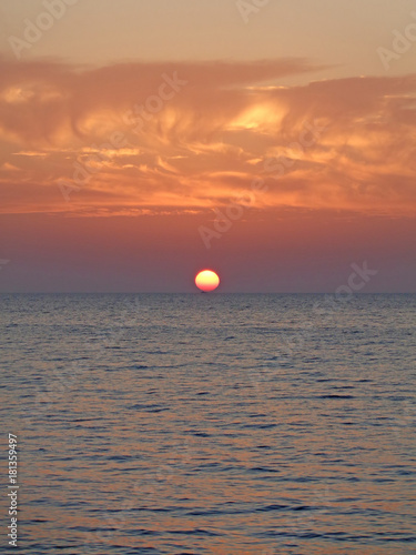 Fototapeta Naklejka Na Ścianę i Meble -  Marine sunset, sun go down in the sea, colorful sky