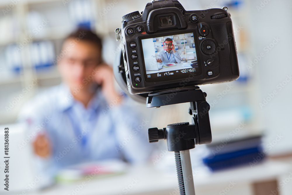 Business blogger doing webcast for his subscribers Business blogger doing webcast for his subscribers