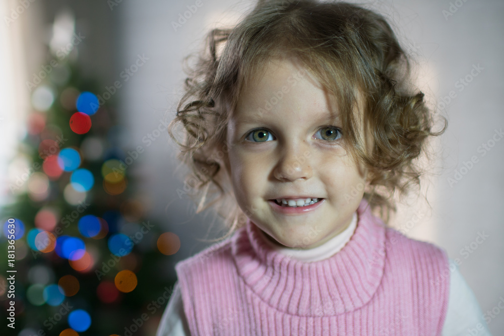 Girl playing in the room with a Christmas tree Girl playing in the room with a Christmas tree