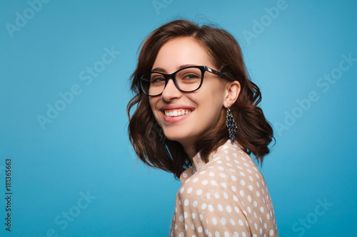 Smiling woman posing in glasses photo