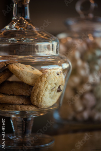 Oatmeal cookie in glass jar  closeup photo
