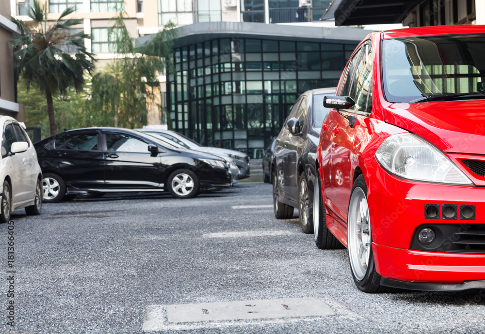 Car parked neatly inside an outdoor parking lot