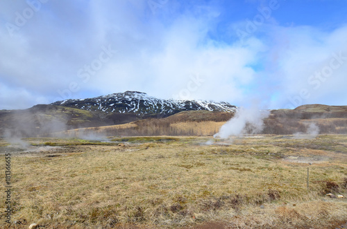 Stunning landscape of an Icelandic steaming geyser photo