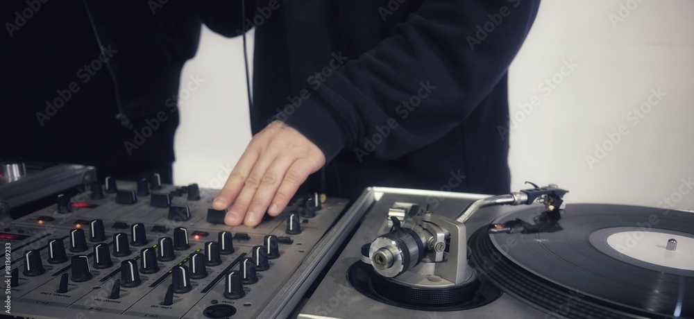 Dj in console with vinyl record