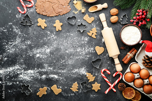 Baking christmas cookies on grey wooden table