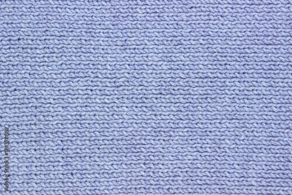 Knitted cloth texture-blue background template for winter holydays cards Knitted cloth texture-blue background template for winter holydays cards