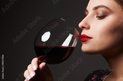 Beautiful young woman with wine