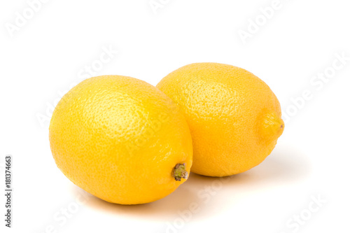 Two lemon closeup on white