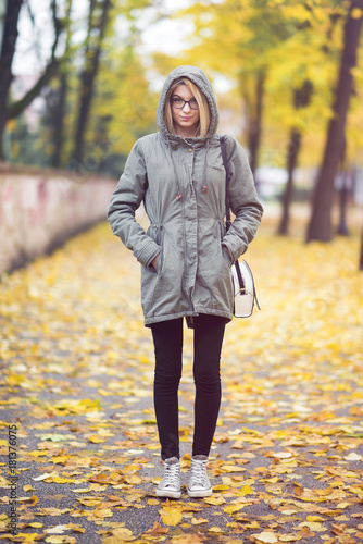 Young hipster woman with glasses in autumn