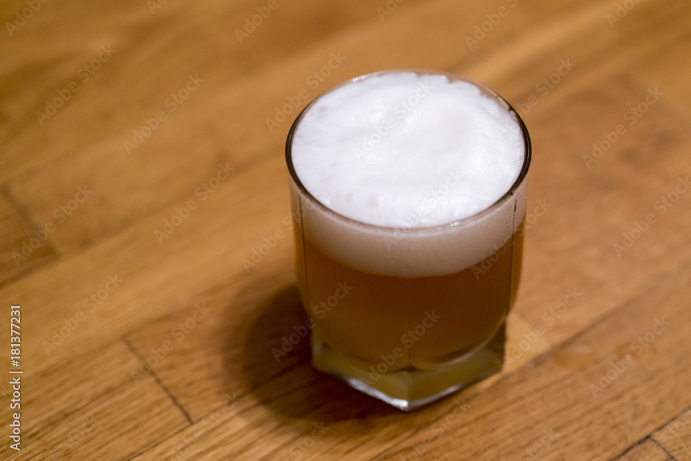 beer in a glass on a wooden background beer in a glass on a wooden background