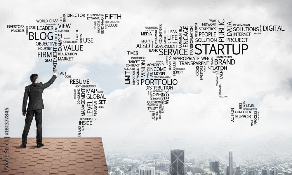 Businessman on brick roof draw world map as concept of globaliza Businessman on brick roof draw world map as concept of globaliza